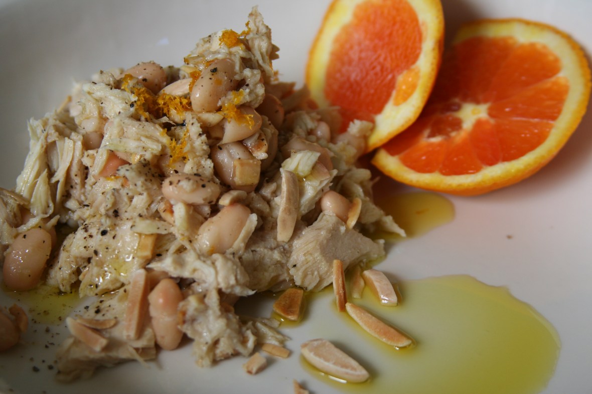 2 jars -Tuna in oil –canned tuna works just as well. 1 can Cannellini Beans-rinsed and drained juice  and zest of ½  Orange  Pinch Sea Salt Toasted Almonds Freshly Ground Black Pepper Olive oil  Zest orange and set aside. Remove tuna from olive oil and place in bowl. Add Beans, Juice from orange a pinch of salt. Add Toasted almonds, pepper and a good drizzle of olive oil. Toss gently and pour into serving bowl. Sprinkle with zest and serve. Eat on its own or accompanied by a nice crostini. 