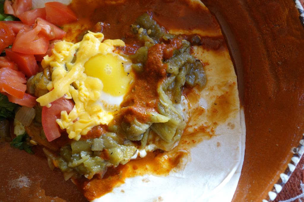 When I visit home the first thing I do after a big family hug is head for the closest  New Mexican resturant to feed my chile jones. Huevos Rancheros with “Christmas” Chile, a combo of both red and green is always my first choice. Here is my best shot at my favorite southwestern breakfast dish. 